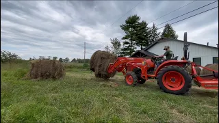 Moving round bales with the kubota L2501.