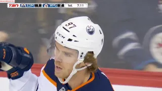 McDavid blows past the defender to backhand it in