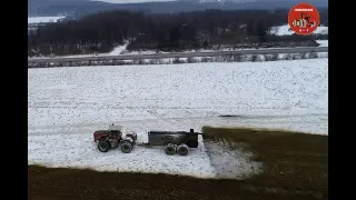 Hauling Cow Manure on a Snow Covered Field.