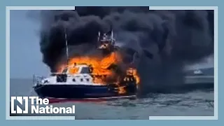 Two rescued from burning boat off UK coast