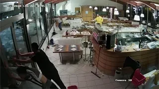 Flash flood smashes through restaurant doors in Venice