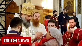 Coronavirus: worshippers still able to attend churches in Georgia despite restrictions - BBC News