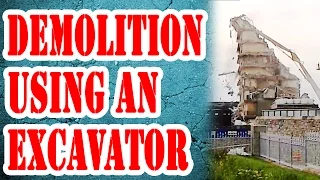 Excavator Demolition  with building collapse - Contractors demolish Hotel with high reach excavator