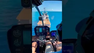 helicopter landing on a yacht