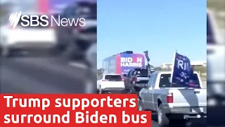 US President Donald Trump supporters surround Joe Biden's campaign bus on Texas highway I SBS News