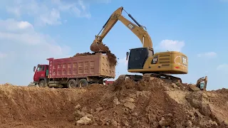 Caterpillar Excavator Loading Soil Trucker