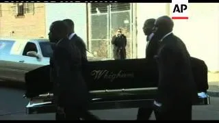 Whitney Houston's casket carried from hearse to church
