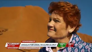 Pauline Hanson climbs the Rock