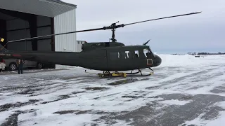 Chopper Spotter Moving a Huey Over Ice