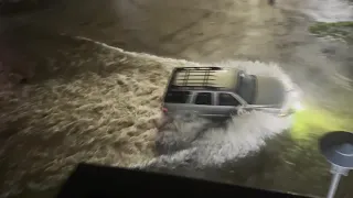 Drivers navigate flooded streets in Fort Worth, Texas