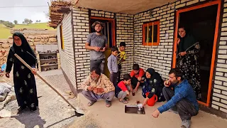 Rural family.  Tahmorth cements the roof of the house to prevent its destruction  #building