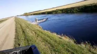 Wakeboarding in the ditch after a good rain