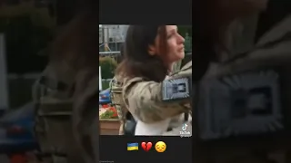 Ukrainian soldiers saying goodbye to their girlfriends