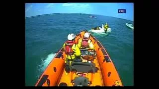 Poole lifeboat launch to capsized dinghy