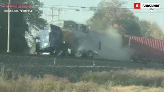 Oncoming Train Collides with Semi Truck Stuck on Railroad Tracks