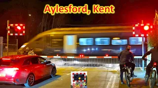 Peak-time trains at Aylesford Level Crossing, Kent