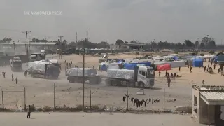 Aid trucks move into Gaza through Rafah crossing as UN, several countries demand more be allowed in