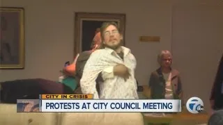 Protesters at Detroit City Council meeting