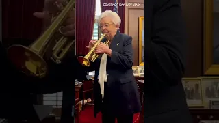 Alabama Governor Kay Ivey plays her trumpet in honor of the start of the college football season