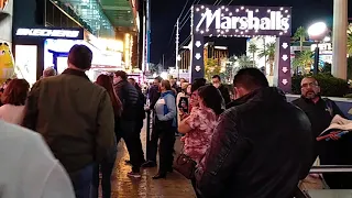 M&M STORE ON LAS VEGAS STRIP IS FILLED TO CAPACITY, LINE OF PEOPLE WAITING IN THE COLD TO GET IN