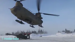 Chinook Helicopter lifts an M777 Howitzer