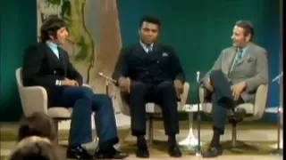 Muhammad Ali talks with Joe Namath in 1969