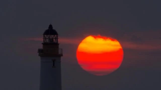 Turnberry lighthouse as the sun sets - time lapse