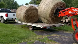 kioti dk4210se hst unloading round bales hay