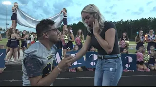 'She said yes!': St. Johns County cheer coach gets surprise proposal during football game