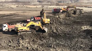 Three Caterpillar 365C Excavators Loading Trucks