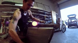 Glassblowing a small glass vase