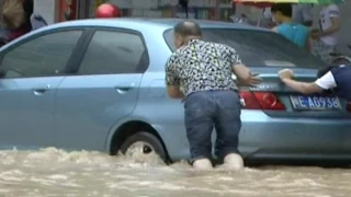 Knee-high Water Floods Roads, Forces Evacuations in S China City