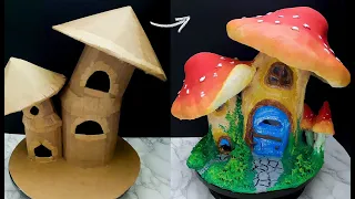 DIY fairy mushroom house using cardboard and paper clay.