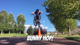 Old man bunny hops a cone on a BMX bike!