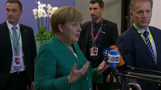 EU Summit: Angela Merkel and Emmanuel Macron react to migrants deal