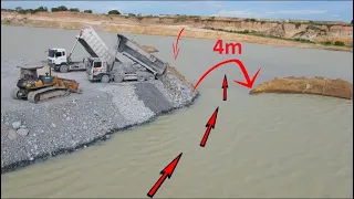 Best action Build in lake New road by bulldozer komatsu pushing big stone into water