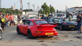 Porsche 911 leaves the Ace Cafe