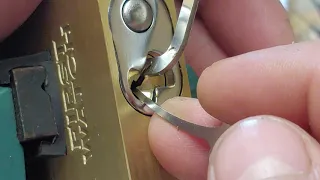 (#28) out the package pick First Watch 50mm brass padlock