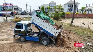 Wonderful Land fill up by 5ton dump truck unloading Soil & Dozer KOMATSU D31PX Pushing Clear