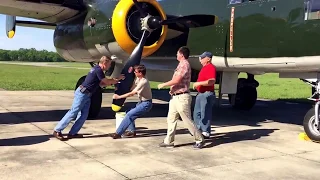 Getting ready for Flight -- Pulling the propeller through on a radial engine