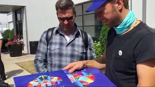 Chris Martin looking at Coldplay vinyls in Chicago