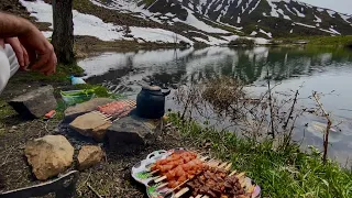 A beautiful camping day by the lake in snowy and sunny weather