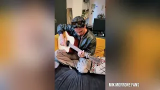 Michele Morrone singing "Hard For Me" and playing guitar