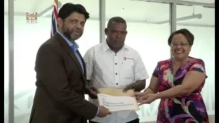 Fijian Attorney-General receives cheque for  COVID-19 Response Fund from Total Fiji Pte Limited