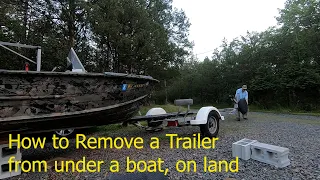 How to remove a boat from a trailer on land
