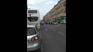 Celtic fans doing a 5-in-a-row huddle on Victoria Road