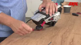 How to replace the planing blades on an electric planer?