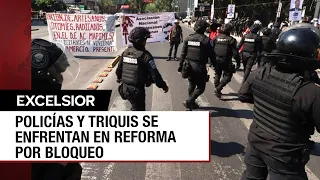 Triquis bloquean Paseo de la Reforma y policías de la CDMX los repliegan