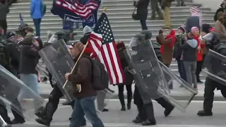 Riot police arrive after Trump supporters storm the US Capitol | AFP