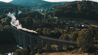 Steam Train on Viaduct Looks like from Harry Potter Movie (Aerial Cinematic Footage 4K)